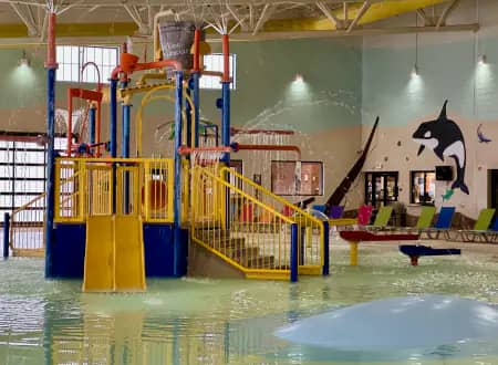 Aquatic Center pool image used on the official hours page.